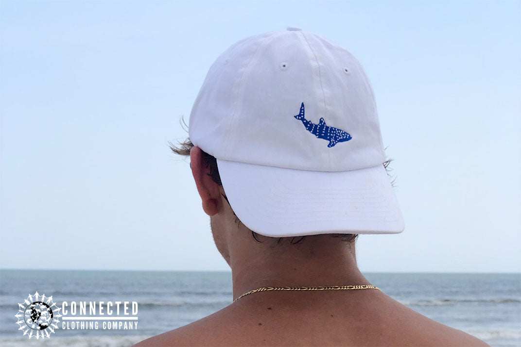 man on the beach wearing white Whale Shark Cotton Cap - - sweetsherriloudesigns - Ethically and Sustainably Made - 10% donated to Mission Blue ocean conservation